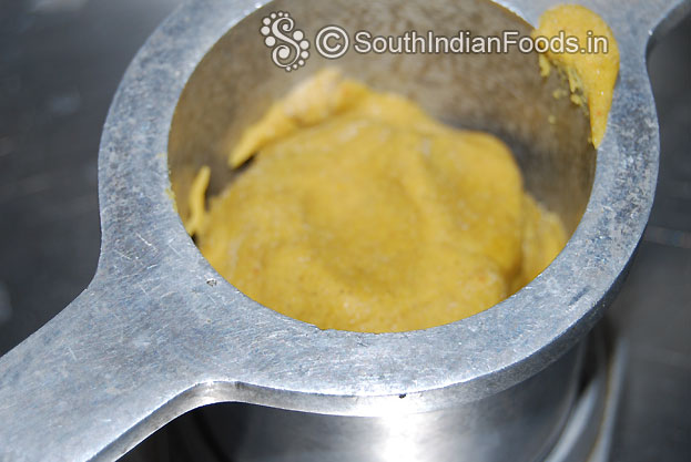 In a muruku kuzhal add one handful of dough gently press