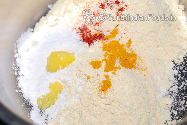 Add ghee, salt, asafetida, turmeric powder mix well then add water make soft dough