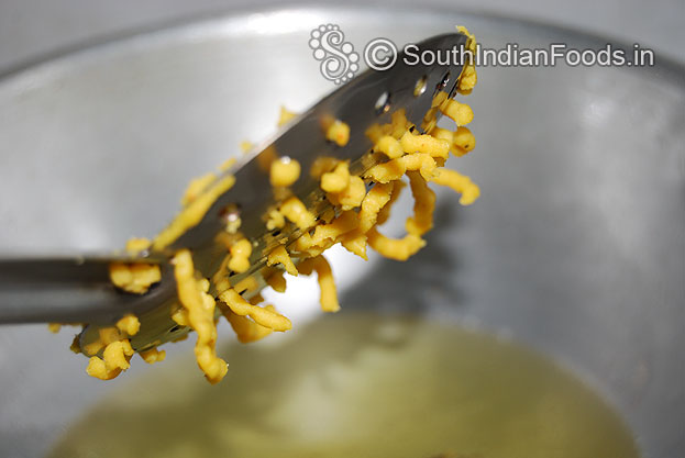 Place lemon size portion of dough on ladle, scratch & deep fry on medium hot oil till crisp