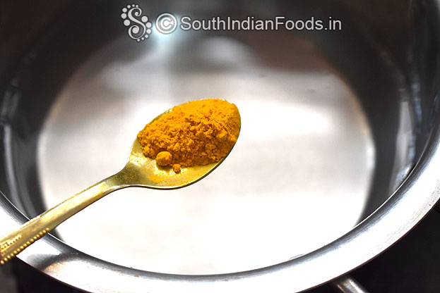 In a bowl add warm water, turmeric powder