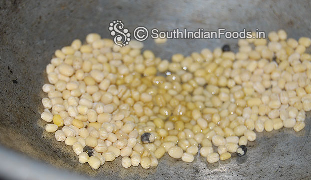 Heat groundnut oil in a pan roast urad dal till light brown