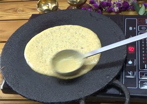 Heat iron dosa tawa, pour batter
