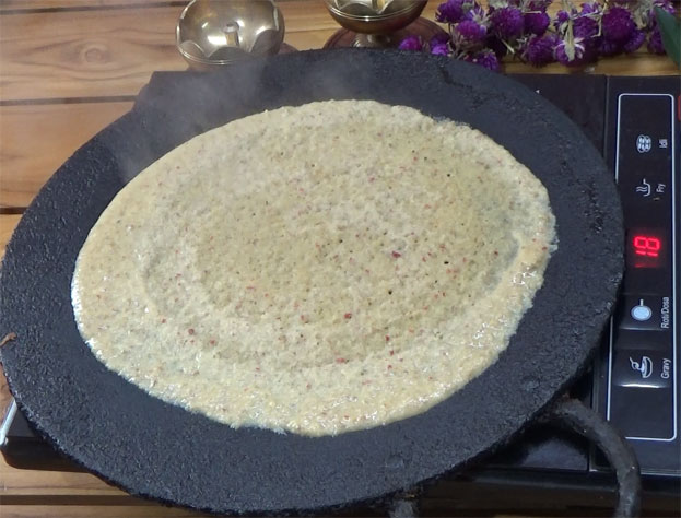 Pour 1 tbsp oil around adai dosa