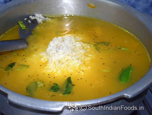 Add soaked rice & salt mix well