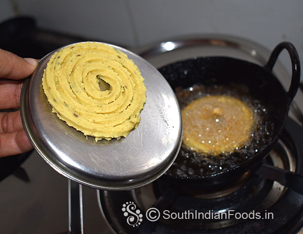 Heat oil in a pan, drop it, deep fry till crisp and golden brown