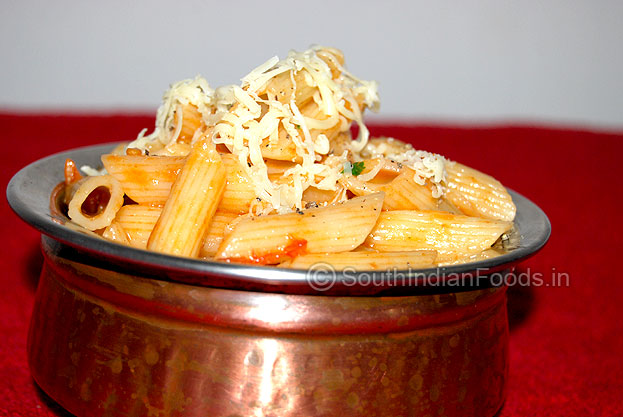 Sprinkle crushed pepper and grated cheese then serve hot