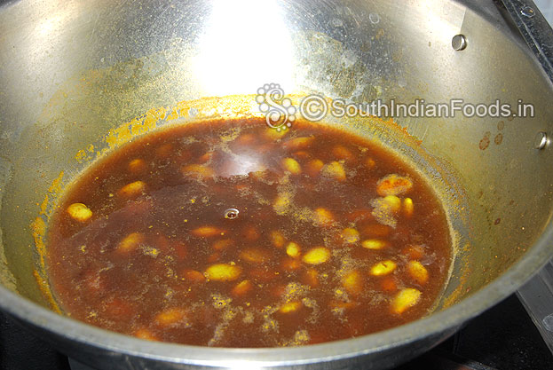 Add tamarind extract, mix well & let it boil.