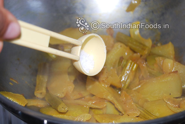 Heat oil in a pan add onion, green chilli, drumstick, mango, turmeric & red chilli powder, salt, sauté till soft. 