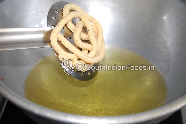 Heat oil in a pan deep fry murukku