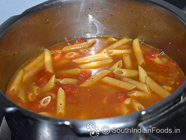 Add water, cover lid, cook for 3 to 4 whistles