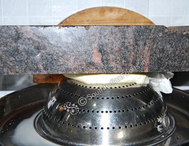 Place about 1 kg weight