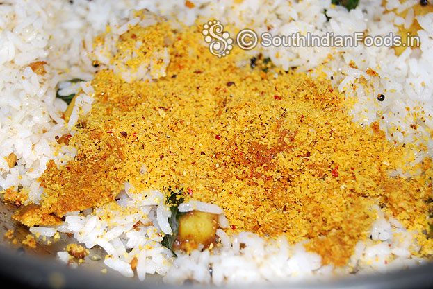 Add boiled rice, freshly ground powder & salt mix well
