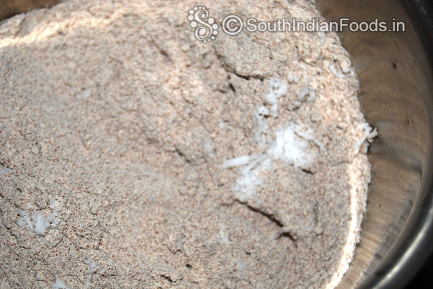In a bowl add, ragi flour, coconut, salt mix well