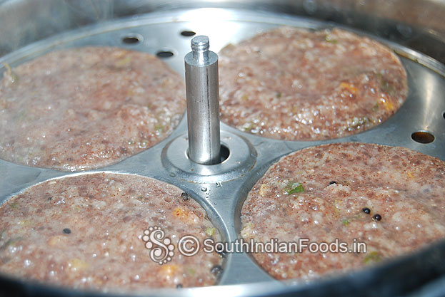 After steaming, idlis are ready & take it out