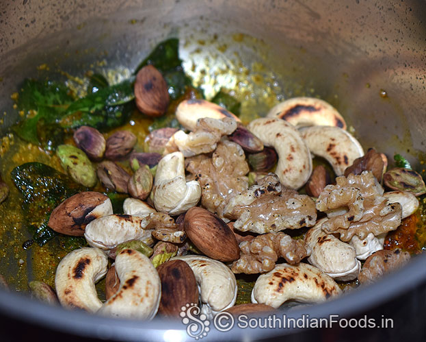 Heat pan again, add roasted mixed nuts