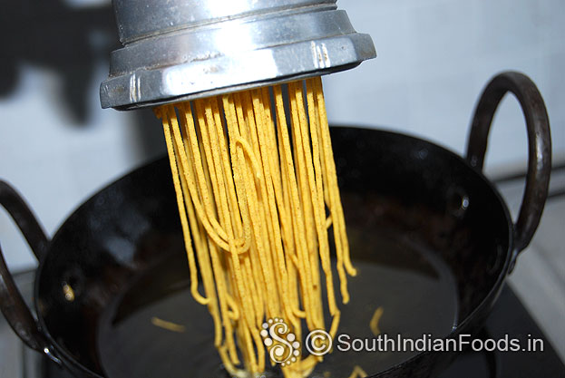 Heat oil in a pan, squeeze and deep fry till crisp