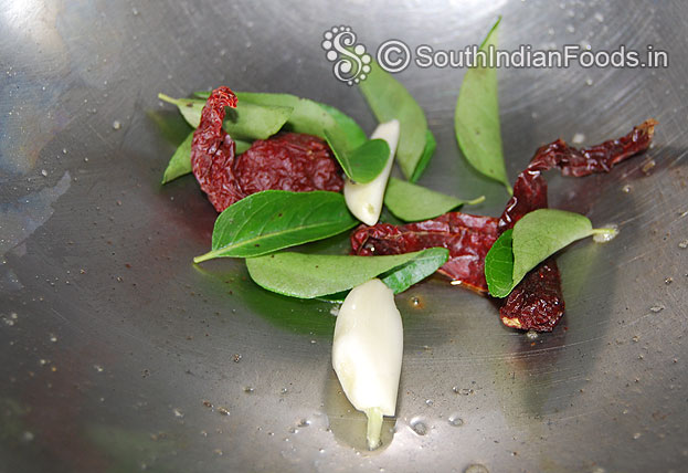 Heat oil in a pan add garlic, dry red chilli & curry leaves saute till light brown