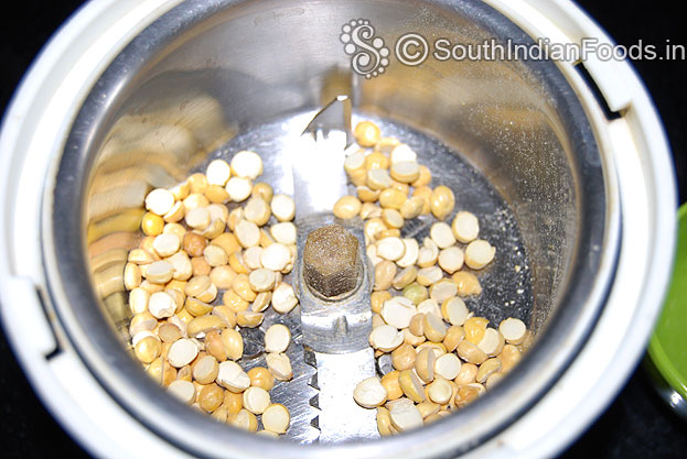 Put 2 tbsp roasted gram in a mixer jar then grind to fine powder.
