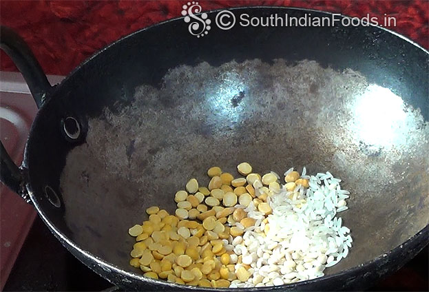 Heat pan, add toor dal, chan dal, urad dal, rice