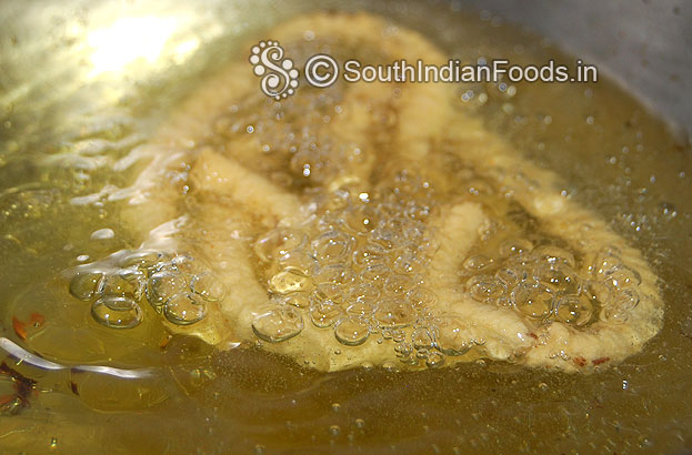 Heat oil in a pan then deep fry till crisp on both sides