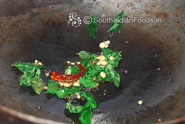 Heat oil in a pan, add mustard seeds & let it splutter, then add bengal gram, urad dal, curry leaves, dry red chilli & green chilli saute