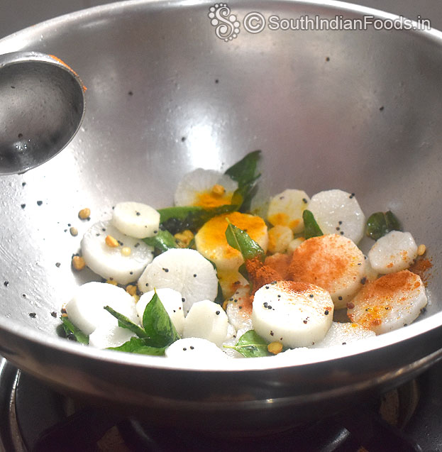 Heat 1.5 tbsp oil, add mustard, chan dal, urad dal, asafoetida, radish, red chilli & turmeric powder