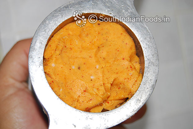 Put handful of varagu maavu in a muruku kuzhal & gently press