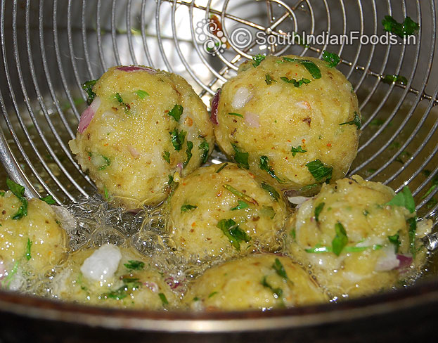 Heat oil in a pan add raw banana balls, deep fry till golden brown & crisp on medium hot oil