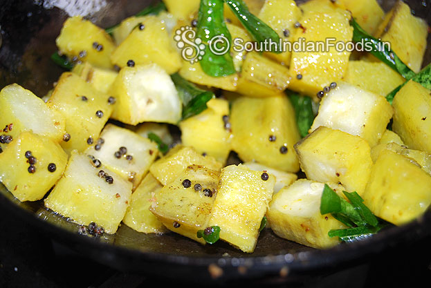 Add boiled raw banana cubes saute gently