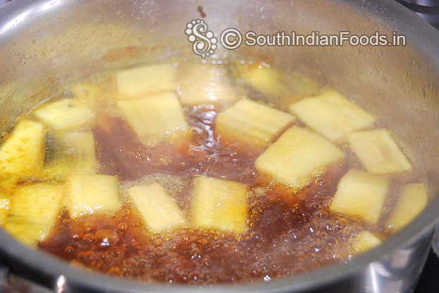 Boil raw banana with turmeric powder and salt