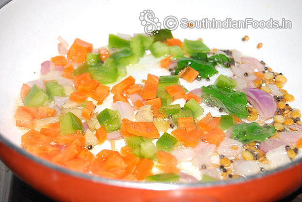 Add carrot, green capsicum saute for a min