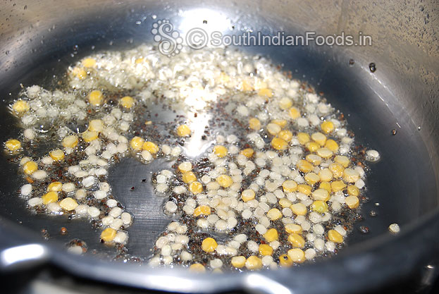 Seasoning-heat pressure cooker, add oil, bengal gram, urad dal