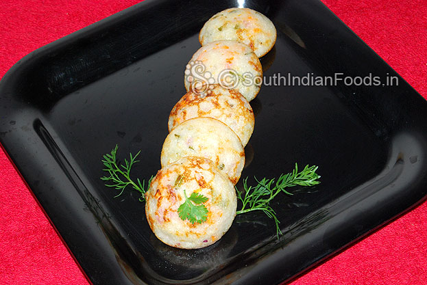 kuzhi paniyaram in black serving plate